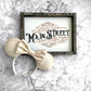 Meet Me On Main Street Sign